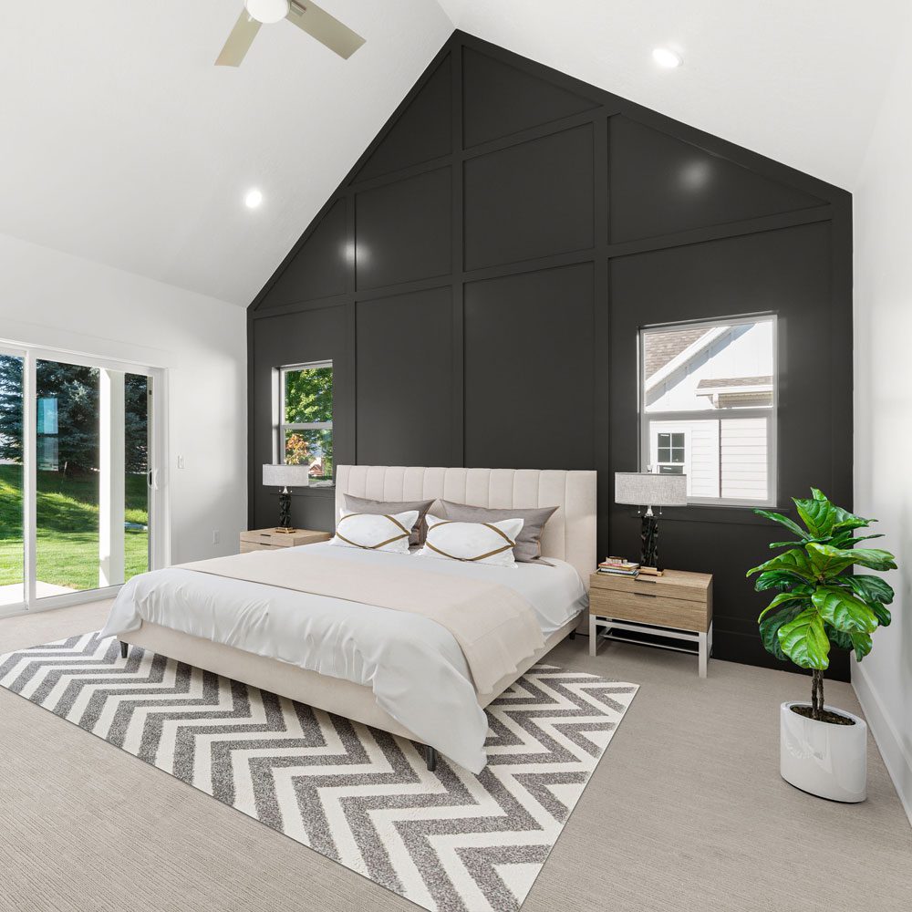 Board-and-batten accent wall carried up a vaulted gable, painted near-black against white — YZ Painting & Finishing, Greater Vancouver