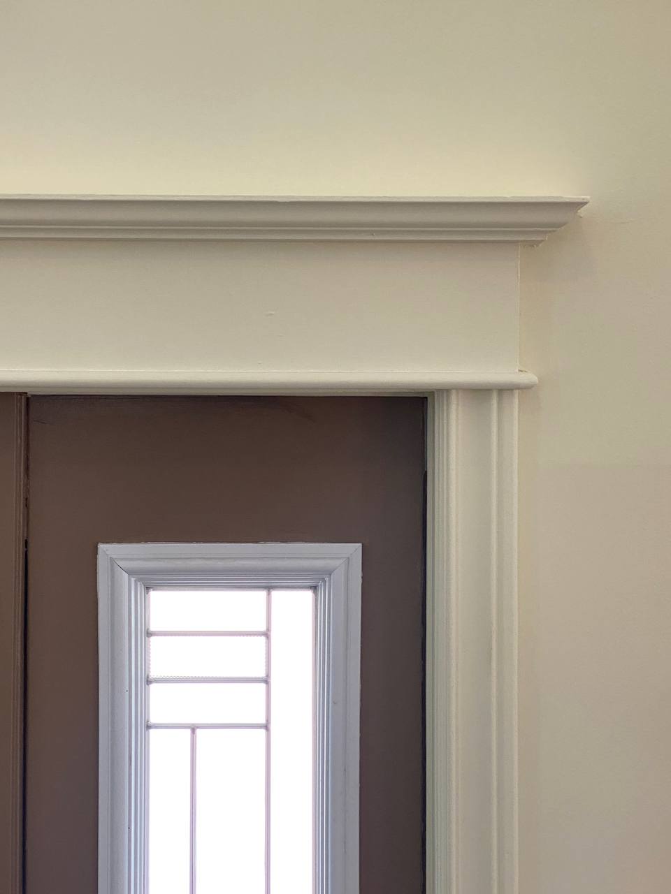 Contrast trim: dark enamel on casings, baseboards and doors against light walls — YZ Painting & Finishing, Greater Vancouver